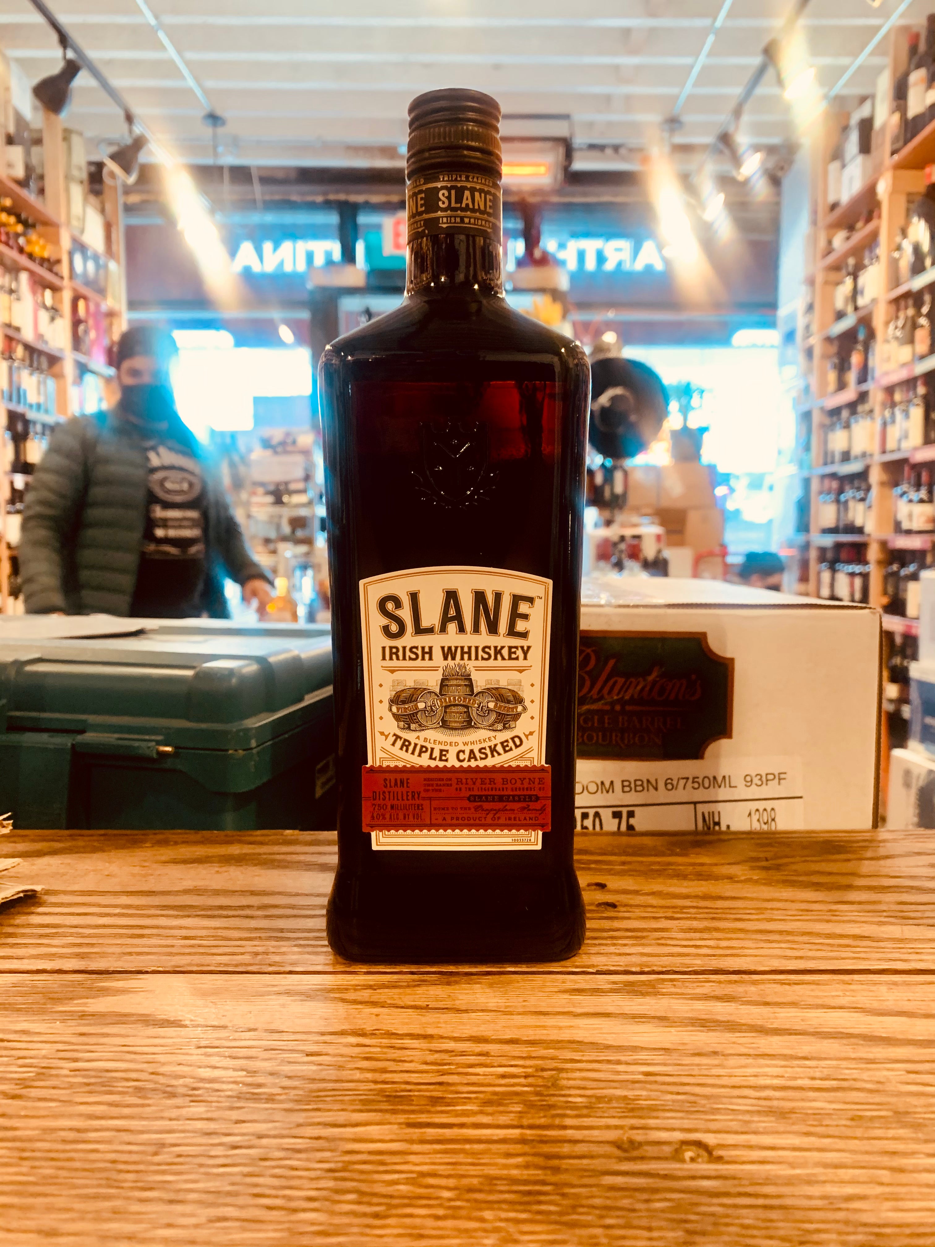 Slane Irish Whiskey 750mL a tall squared dark glass bottle with a white and red label and a black top