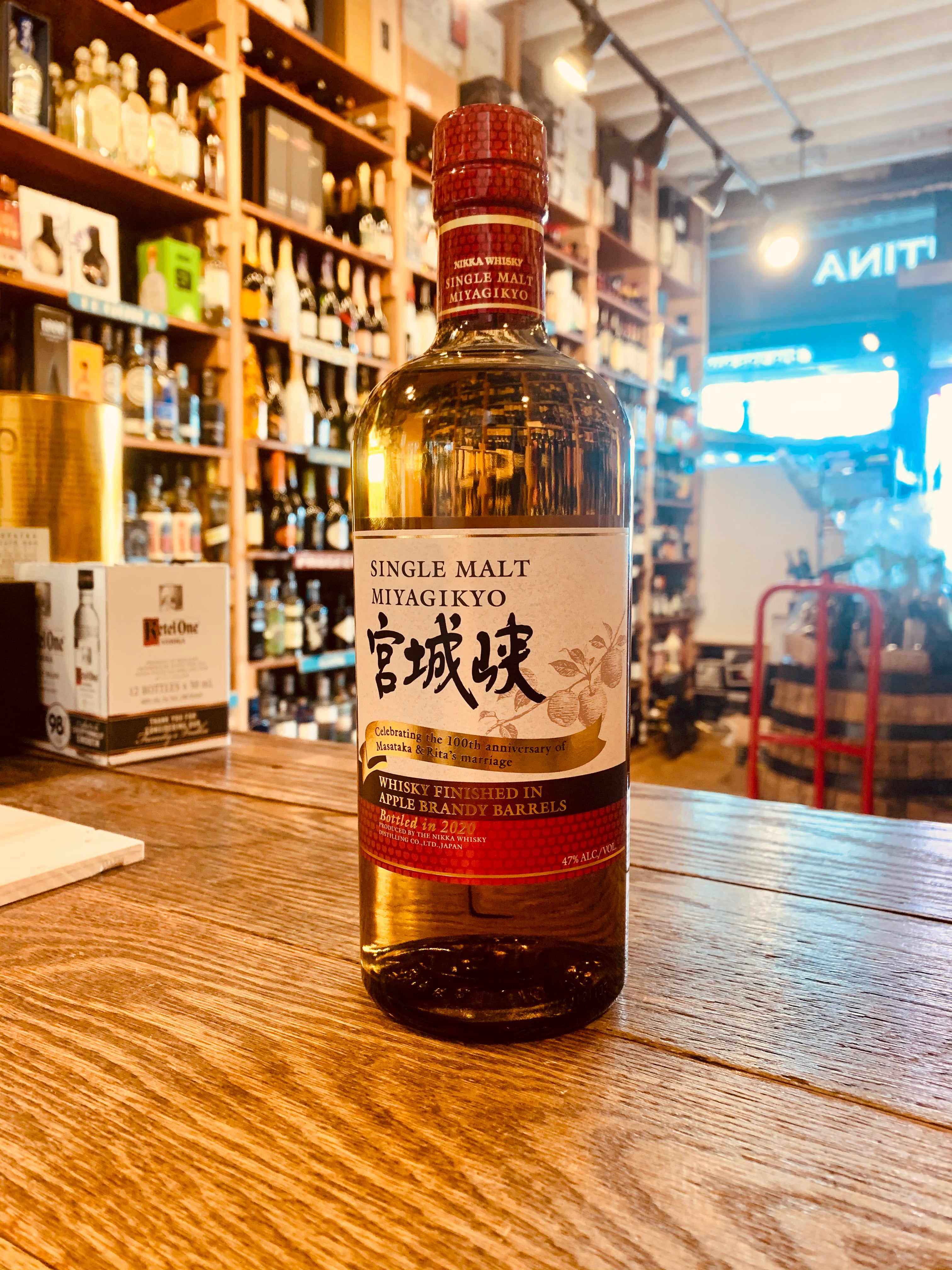 Nikka Miyagikyo Single Malt Whisky 750mL Apple Brandy Barrels a high shouldered round clear glass bottle with a white label and red top