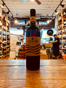 Lignum Italian Red Blend 750mL a tall dark glass wine bottle with a brown label and dark top