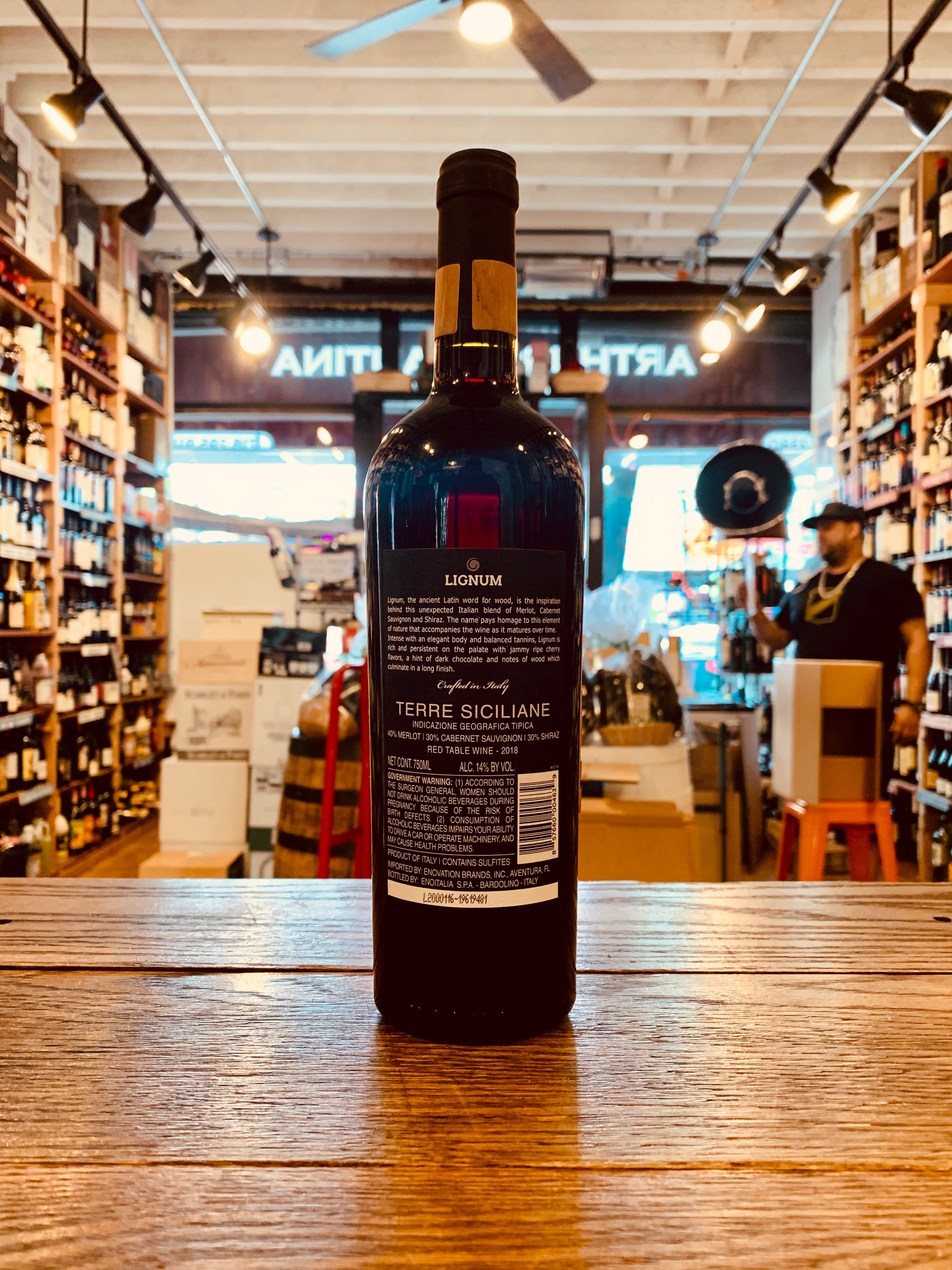 Lignum Italian Red Blend 750mL the backside of a tall dark glass wine bottle with a black label and black top