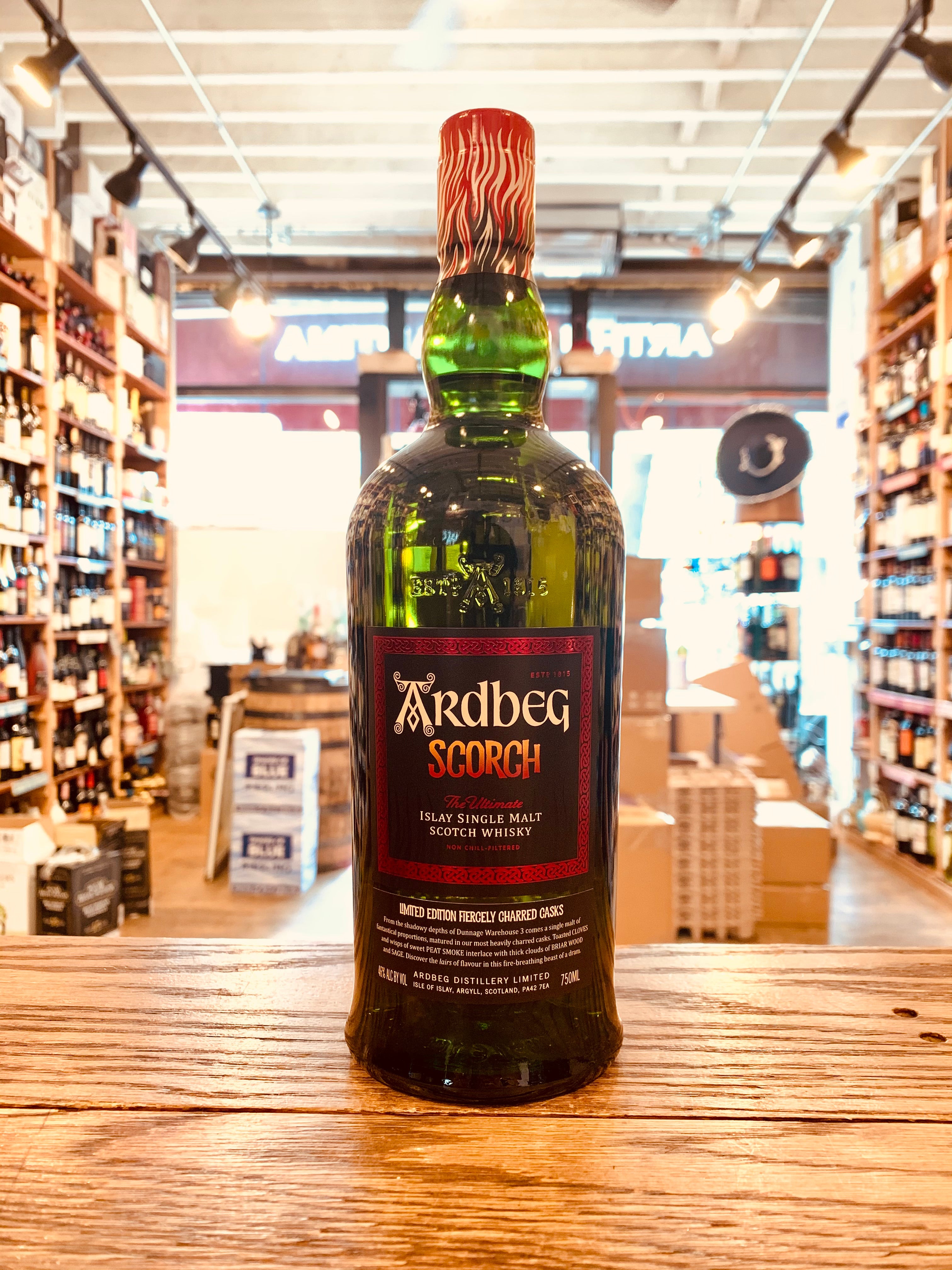 Ardbeg Scorch Black Label Islay Single Malt Whiskey green bottle with a black and red label and red top