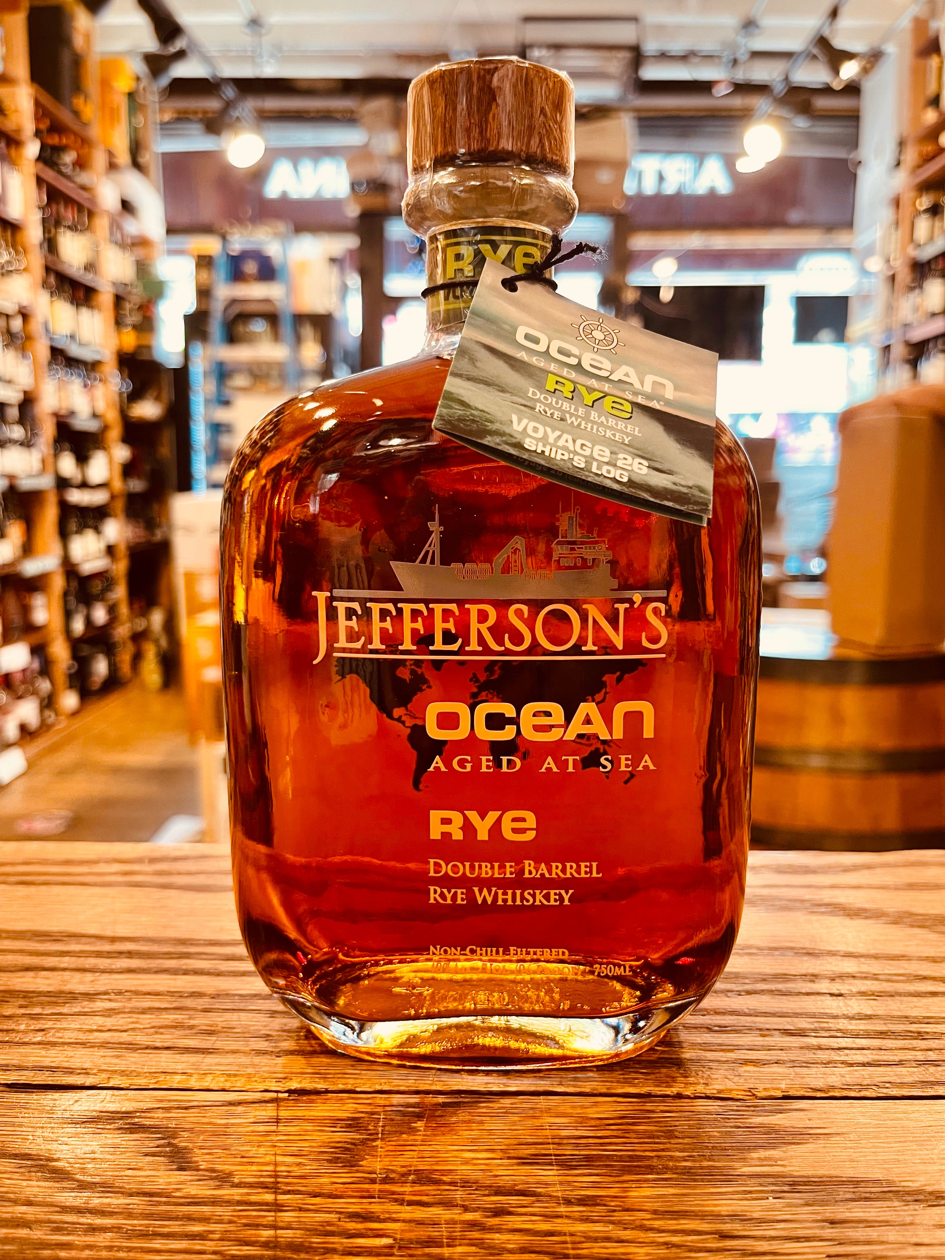 Jefferson's Ocean Aged at Sea Rye Double Barrel Voyage 26 750mL a square rounded clear bottle with golden lettering and a wooden top