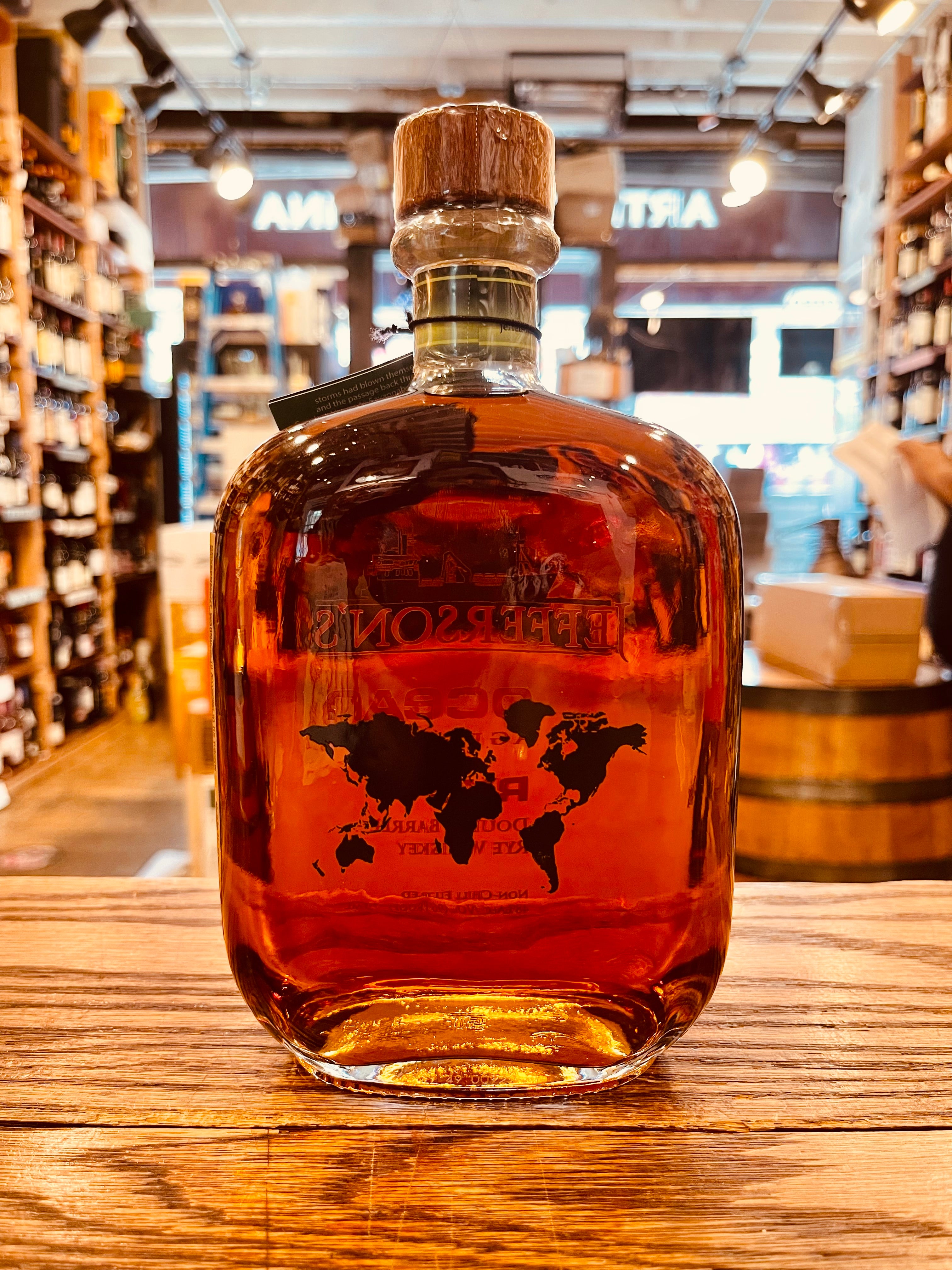 Jefferson's Ocean Aged at Sea Rye Double Barrel Voyage 26 750mL the backside of a clear square rounded glass bottle with the image of the atlas on the bottle