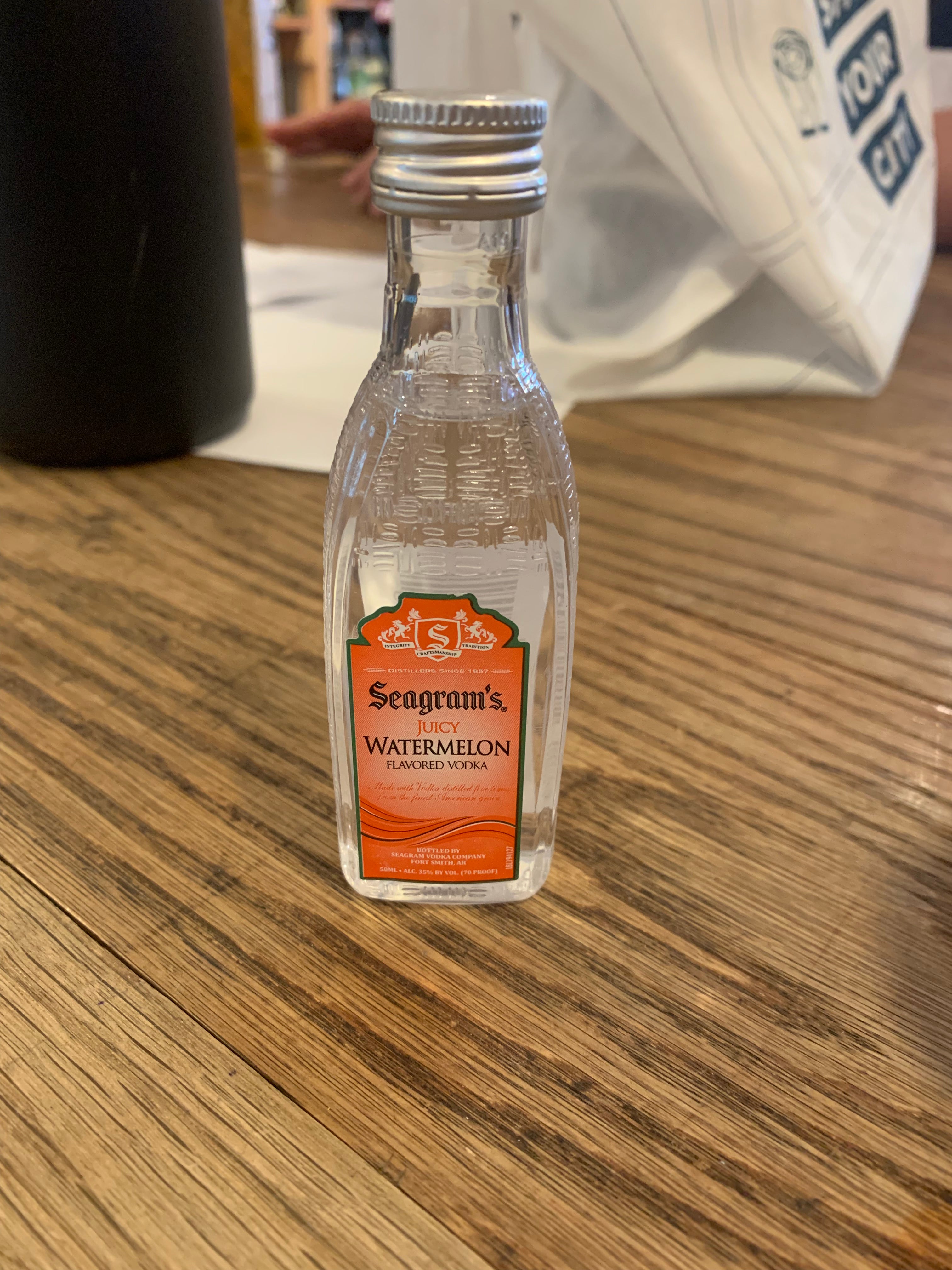 Seagrams Juicy Watermelon 50mL a small squarish plastic bottle with an orange label and silver top