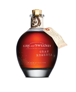 Kirk & Sweeney Gran Reserva 750ml  short round circular clear glass bottle with white lettering short neck and wooden top