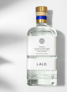 Lalo Tequila 750mL a squat squared clear glass bottle with a white label and golden top