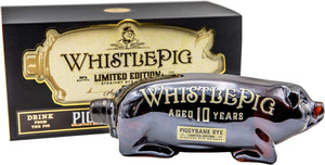 Whistle Pig Piggybank Rye 1L a rectangle black and beige box with a pig on the front of it with a clear glass bottle in the shape of a pig in front of the box